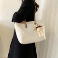 Large white tote bag with brown straps and a cute teddy bear charm for daily commuting - With Charm / White