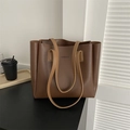 Brown leather large capacity tote bag with long shoulder straps and debossed branding - Coffee No Charm
