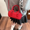 Red Boston bag in matte and litchi leather with top handles and shoulder strap - Red