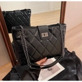 Quilted black tote bag with silver chain straps and turn-lock closure in premium leather - Black