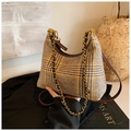 Detail of retro houndstooth crossbody bag with chunky metal chain and leather strap - Brown