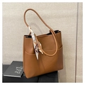 Caramel brown pebbled leather bucket bag with silk scarf and side pocket detail - Brown