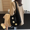Black plush knit crescent shoulder bag with colorful star badges and bow detail - Black