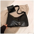 Glossy black hobo shoulder bag with golden hardware and wide strap on beige fabric - Black without Pendant