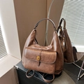 Retro dark brown hobo bag with vintage metal hardware and premium leather texture - Brown