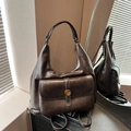 Deep brown vintage oil wax leather dumpling bag with golden metal hardware detail - Coffee