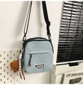 Detail of light blue nylon crossbody bag with zipper pocket and cute dog plush pendant - With Charm / Blue