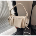 Close-up of cream retro underarm bag with multi-zipper pockets and silver hardware - Off White
