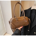 Brown faux leather Boston bag with long handles and glossy finish in retro style - Brown