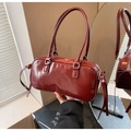 Glossy burgundy Boston bag for women with decorative side bows and shoulder straps - Red