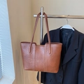 Brown large tote bag with contrast stitching and slim shoulder straps on a hanger - Brown No Pendant