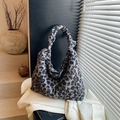 Fuzzy leopard print hobo bag with a knotted strap detail for winter casual wear - Leopard Print Black