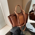 Brown litchi grain tote bag with wing design and dual straps for shoulder or hand carry - Brown