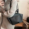 Black pebbled leather tote bag with white contrast stitching and large capacity design - Black