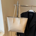 Minimalist off-white large capacity leather tote bag with long handles for shoulder wear - Beige