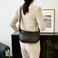 Minimalist black PU leather hobo bag in half-moon shape with a soft wrinkled texture finish - Black