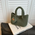 Dark green knitted bucket bag with a small coin purse and handmade label tag - Green