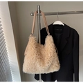 Detailed view of plush apricot faux fur tote bag with smooth leather straps and silver rings - Khaki