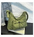 Detailed view of avocado green padded nylon shoulder bag with knotted strap and drawstring pocket - Green