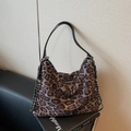 Chic leopard print hobo bag with black leather strap and silver chain details - Black Leopard