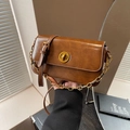 Vintage brown leather crossbody bag with gold rotating lock and chunky metal chain - Brown