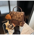 Detail of leopard print suede handbag with brown leather trim and cute teddy bear charm - Khaki With Pendant