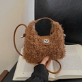 Brown faux fur plush handbag with leather handle and silver metal twist lock closure - Brown