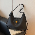 Elegante borsa tote nera patchwork con dettagli in vernice e finiture metalliche oro - Nero