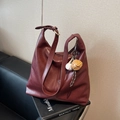 Retro burgundy leather tote bag with adjustable strap and baseball glove charm detail - Ankora Red With Charms