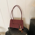 Retro burgundy frosted shoulder bag with stylish decorative pendant and thin straps - Red
