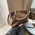 Minimalist pleated bucket bag in dark brown leather with unique spiral handle design - Khaki