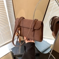 Brown vintage matte faux suede shoulder bag with retro charm and stylish strap detail - Brown