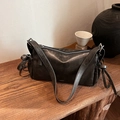Retro black leather crossbody bag with adjustable wide strap and unique side knot detail - Black