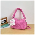 Detail of pink faux fur shoulder bag with cute plush dog pendant and soft texture - Pink