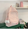 Close-up of pink nylon backpack featuring a cute white plush cloud charm and KEKEMI logo - With Charm / Pink
