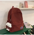 Dettaglio dello zaino in tela bordeaux con ciondolo a nuvola e logo tondo KEKEM - Con Ciondolo / Rosso