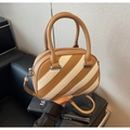 Detail of Boston bag showing brown and cream stripe texture and silver sphere hardware - Khaki