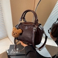 Retro dark brown oily leather bowling handbag with cute plush bear charm accessory - Coffee