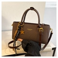 Detail of dark brown faux leather handbag with gold hardware and star pendant - Coffee (With Charm)