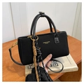 Chic black textured handbag with leather handles and decorative woven lanyard detail - Black (With Pendant)