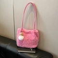 Hot pink plush shoulder bag with long faux fur texture and cute doll keychain charm - Pink