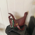 Vintage dark red hobo crossbody bag with adjustable buckle strap and rope detail. - With Pendant / Red