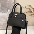 Classic black litchi texture leather handbag with silver lock and adjustable strap - Black