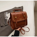 Vintage brown PU leather backpack with gold buckle and rivet detail in hand - No Pendant / Brown