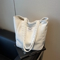 Off-white corduroy tote bag with Kiss Your Cheek label and textured vertical stripes - Off-white