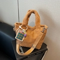 Brown plush bucket bag with wide shoulder strap and colorful calculator pendant charm - Brown with Pendant