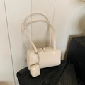 Cream white boston bag in glossy faux leather with a small matching coin purse attachment - White with Pendant