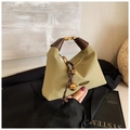 Detail of khaki minimalist handbag with brown leather handle and gold bell charm ornament - Green with Pendant