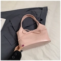 Pink faux leather underarm handbag featuring a decorative bow and embossed lettering - Style 1 Pink
