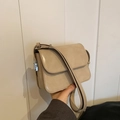 Beige rectangular leather crossbody bag with silver buckle and adjustable strap - Khaki